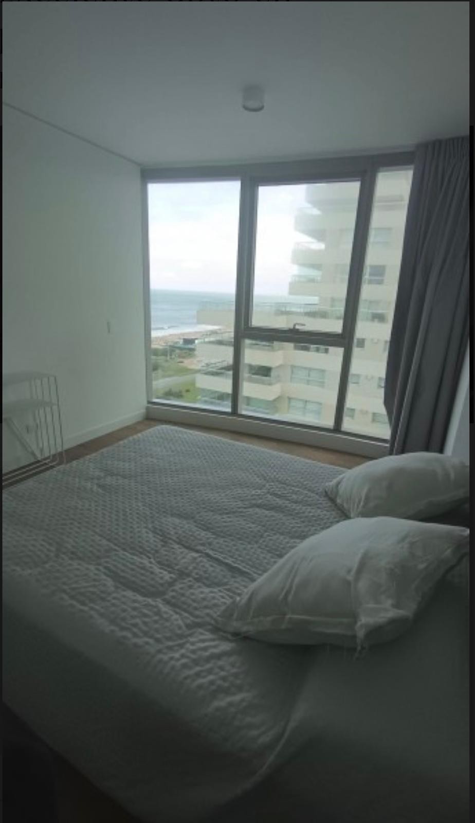 Alquiler ANUAL Exclusivo: Apartamento Moderno con Vistas Panorámicas en Trump Tower Punta del Este. (Unidad Compartida 2 inmob.). Unidad 1203 · Foto 3
