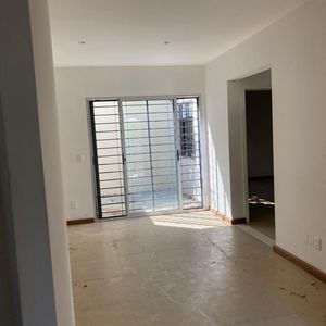 Venta Casa 2 Dormitorios  En Malvín Con Cochera Y Parrillero, Con Renta. Vivienda Promovida