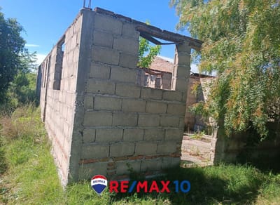 Terreno con Mejoras