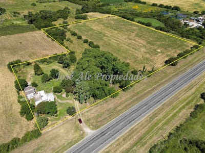 OPORTUNIDAD EN VENTA CAMPO DE 4HAS y 8.322M CON CASA DE 3 DORMITORIOS UBICADO ENTRE RUTA Nº1 Y JUAN LACAZE, COLONIA.