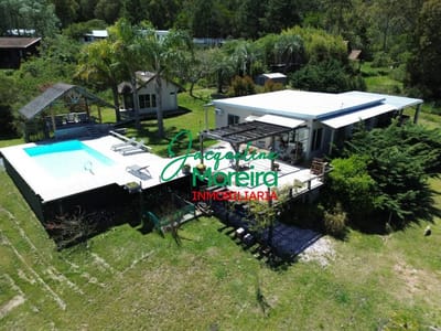 **CH101181** BAGUALA, CHACRA con 2 Casas, 1.6 hectáreas de jardín y vista al mar, a sólo 10 cuadras playa Las Flores. Piriapolis