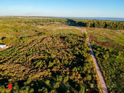 Terreno con vista al río. Zona en expansión. Buen acceso.